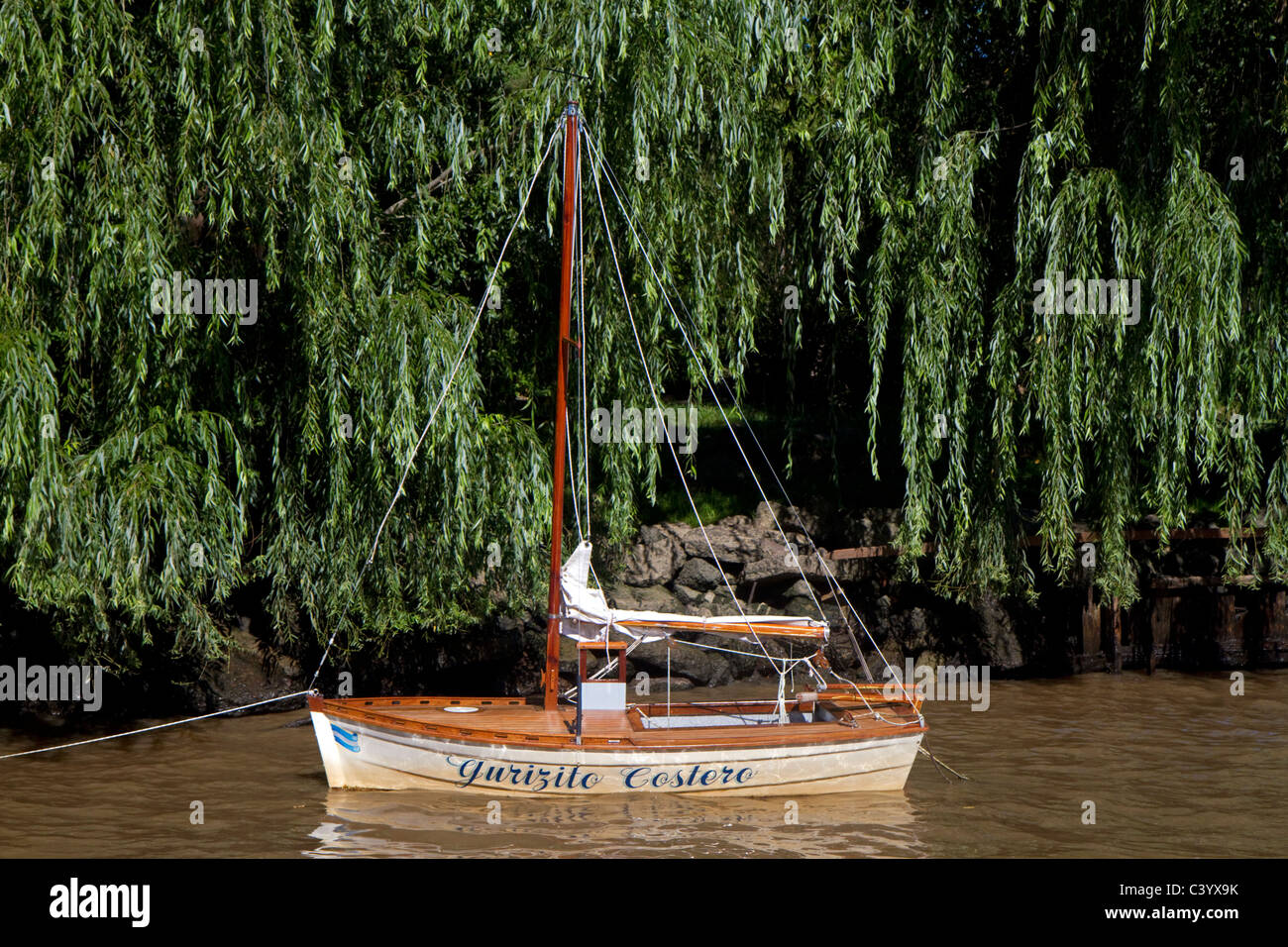 Small sail boat on the Parana Delta at Tigre, Argentina. Stock Photo