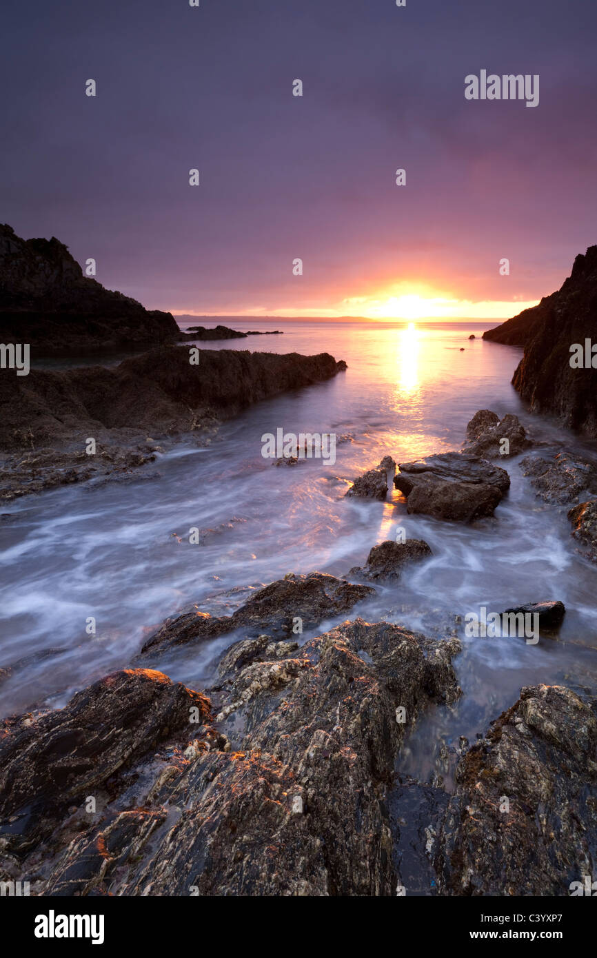 Sunrise on the rocky shores of Mevagissey, South Cornwall, England. Spring (May) 2011. Stock Photo