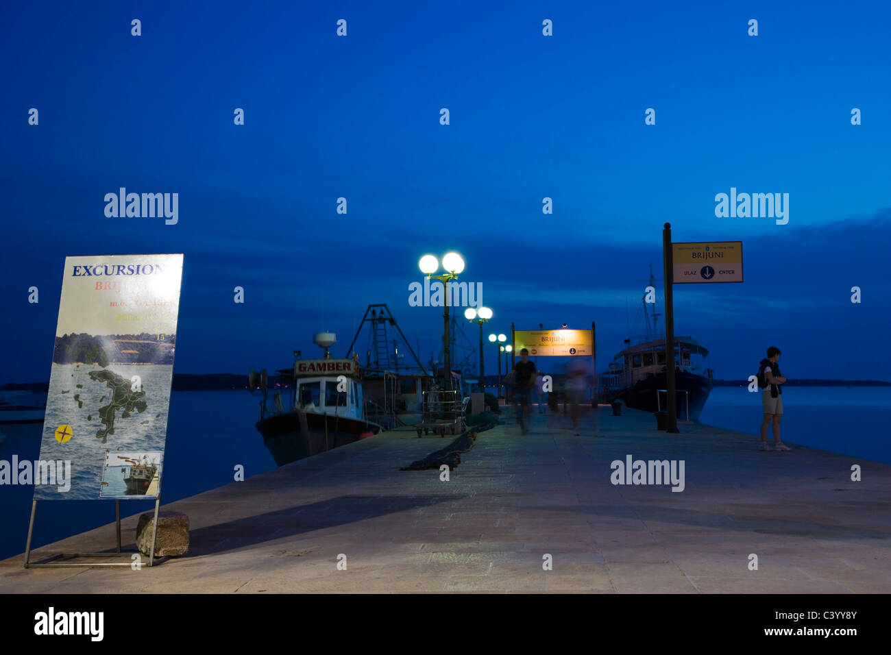 Harbour of Fazana with fishing and excursion boats to Brijuni Islands, Twilight, Istria, Croatia Stock Photo