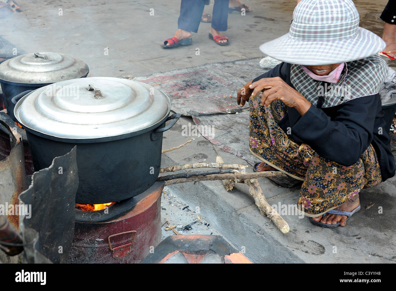 Woman cooking freshly caught crabs in Kep Crab market, Southern Cambodia. Stock Photo