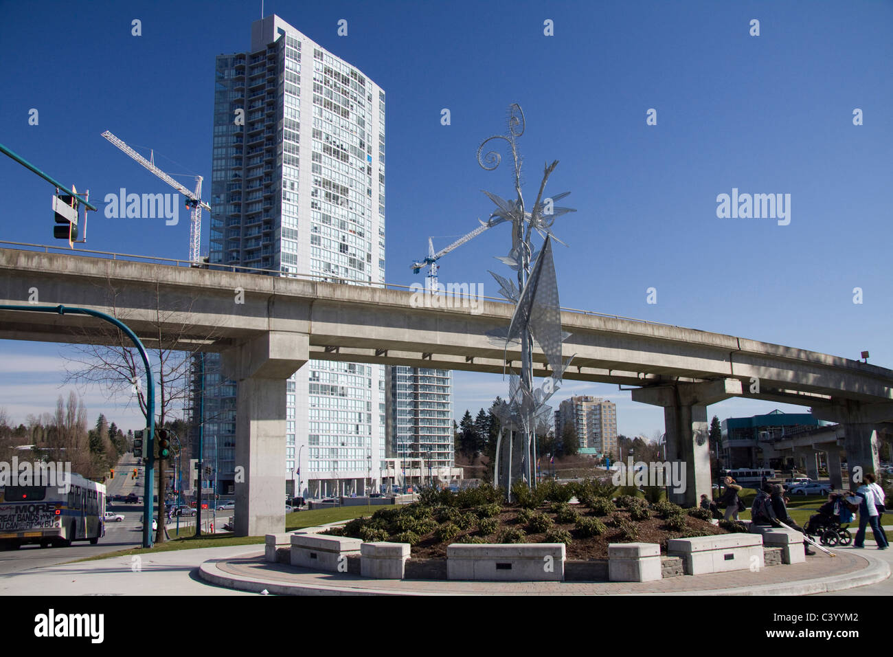 Holland Park with skytrain track overhead, Surrey Central, BC, Canada Stock Photo