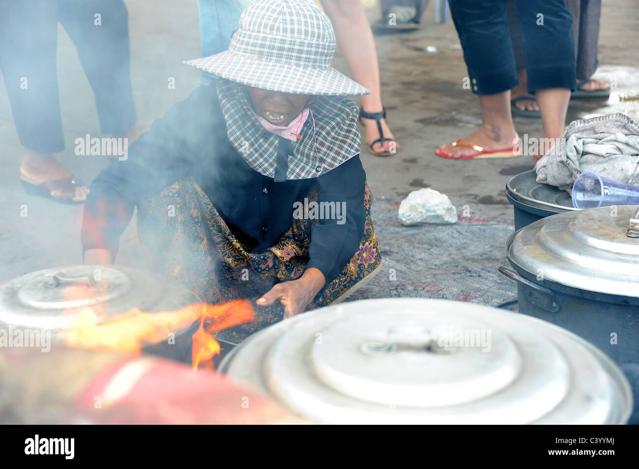 Woman cooking freshly caught crabs in Kep Crab Market, Southern Cambodia. Stock Photo