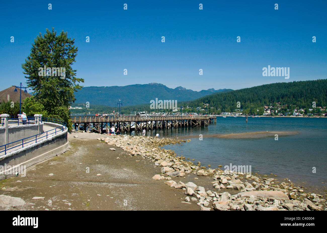 Rocky Point Pier with North Shore Mountains behind, Port Moody, BC, Canada Stock Photo