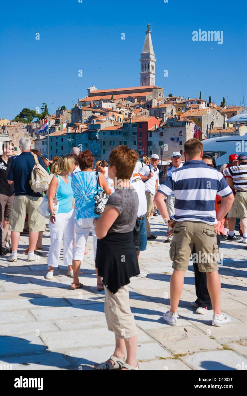 Tourists on the pier of the southern harbour of Rovinj, Istria, Croatia Stock Photo