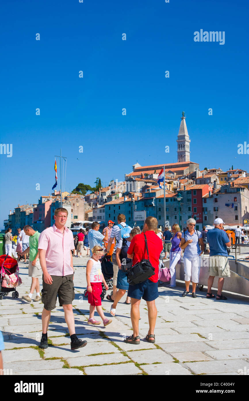 Tourists on the pier of the southern harbour of Rovinj, Istria, Croatia Stock Photo