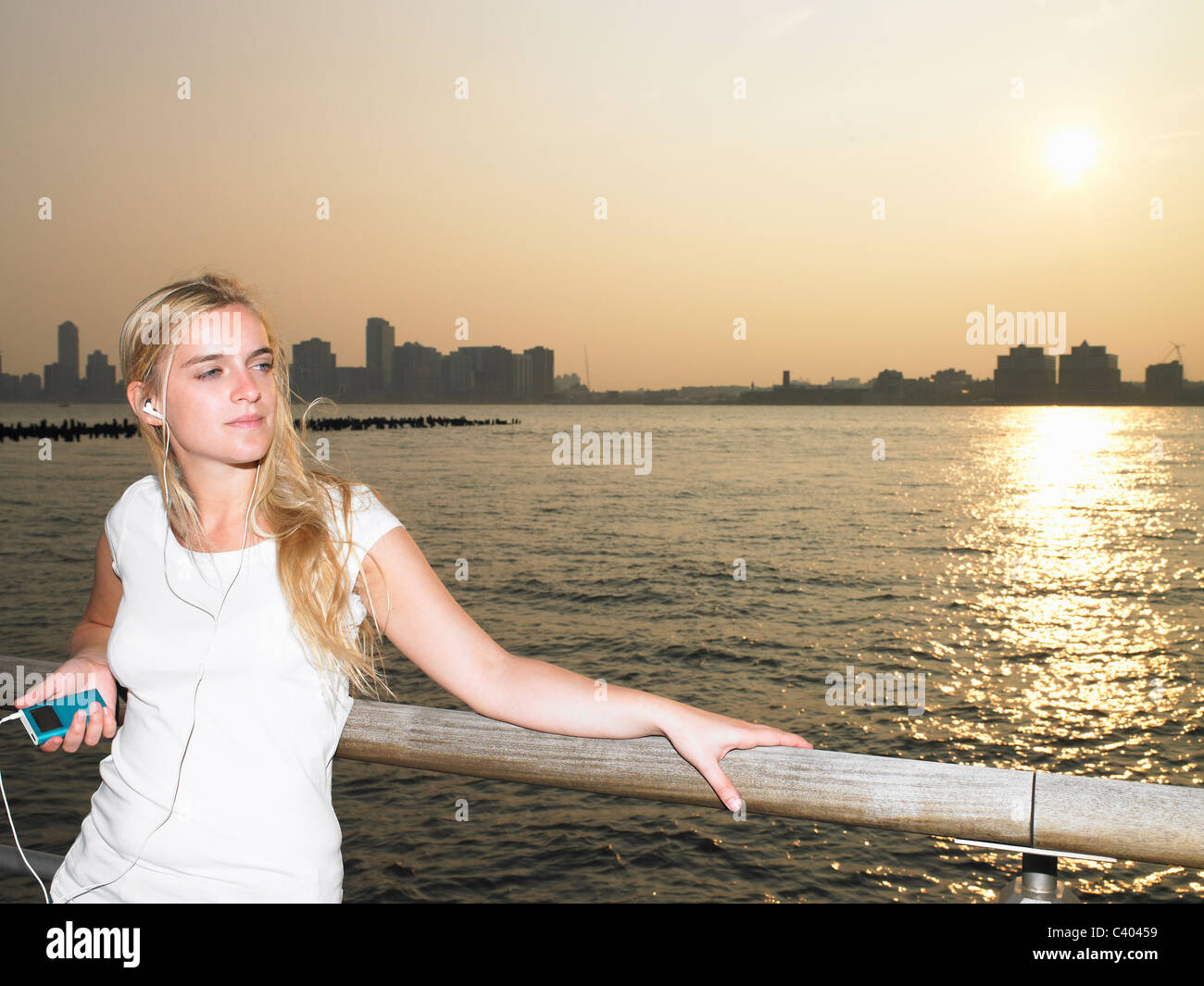 Woman listening to her mp3 player Stock Photo