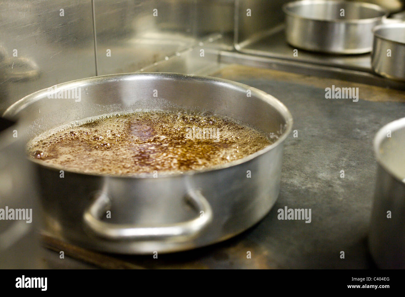 A big pot of bubbling caramel Stock Photo