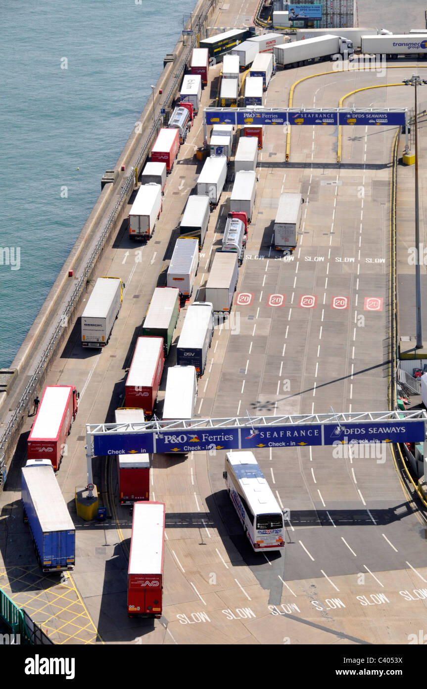 Dover port aerial view trucks lorries & trailers queuing below gantry sign shows ferry routes for lorry truck tickets & boarding Kent England UK Stock Photo
