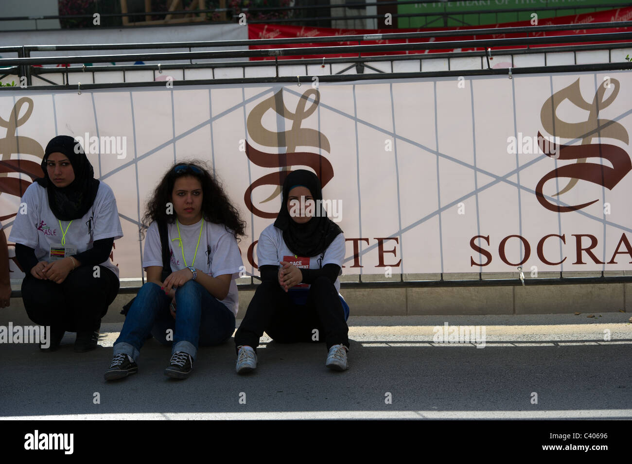 three young Muslim girls setting on the ground Stock Photo