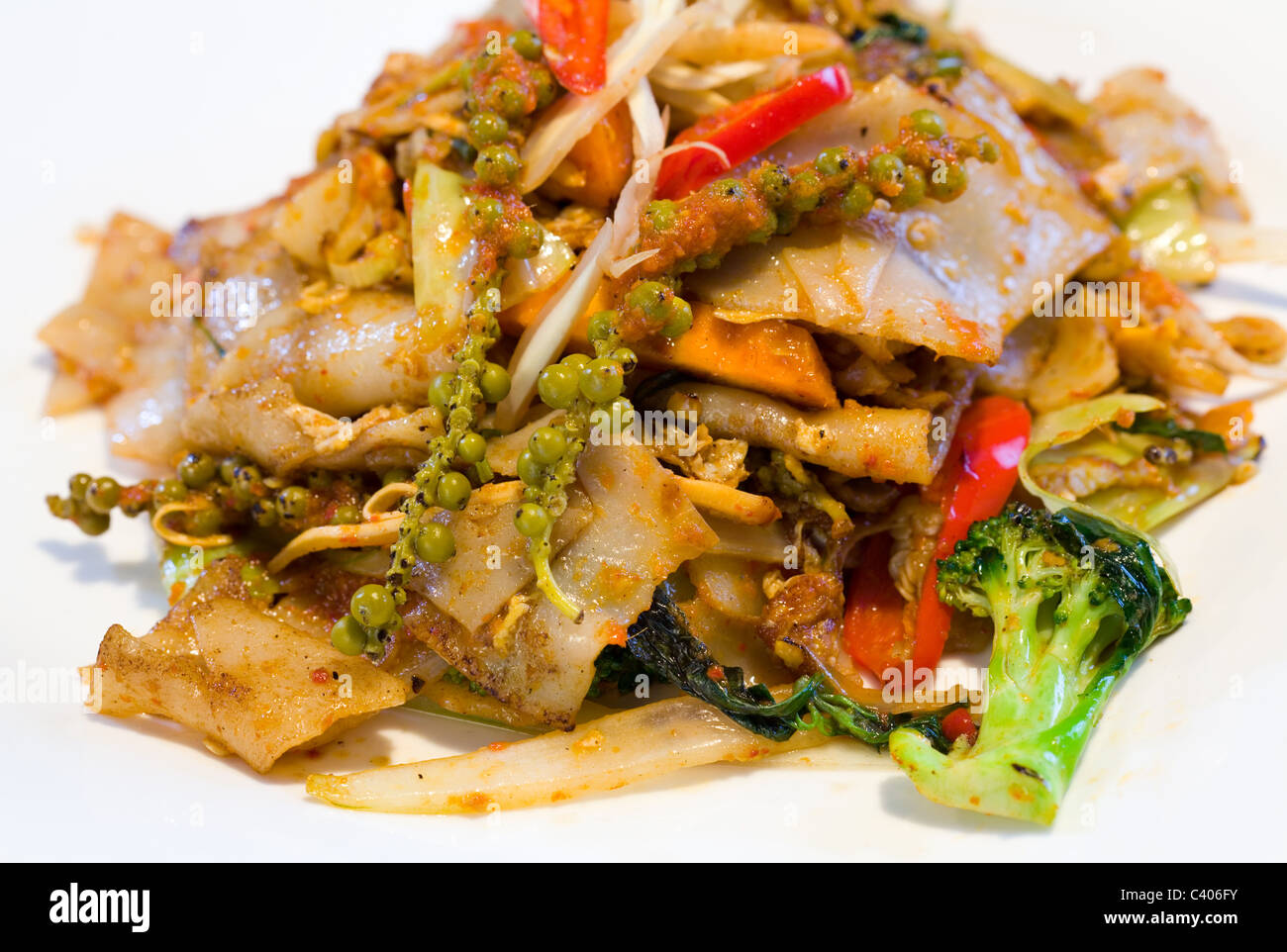 Thai Pad Cha Noodles made with jungle curry paste and fresh herbs Stock Photo