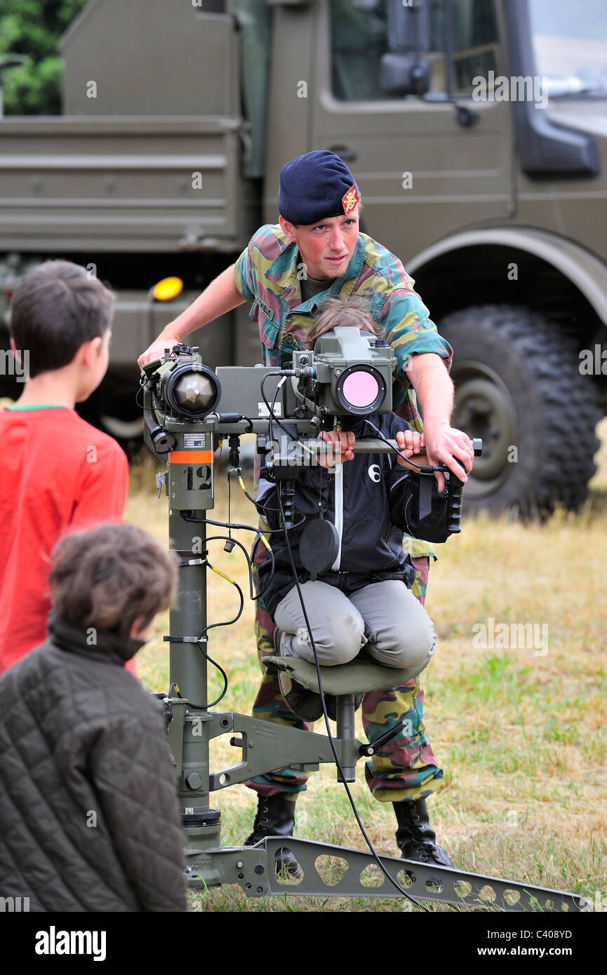 Soldier showing Mistral Air Defence Missile System to child during open day of the Belgian army at Leopoldsburg, Belgium Stock Photo