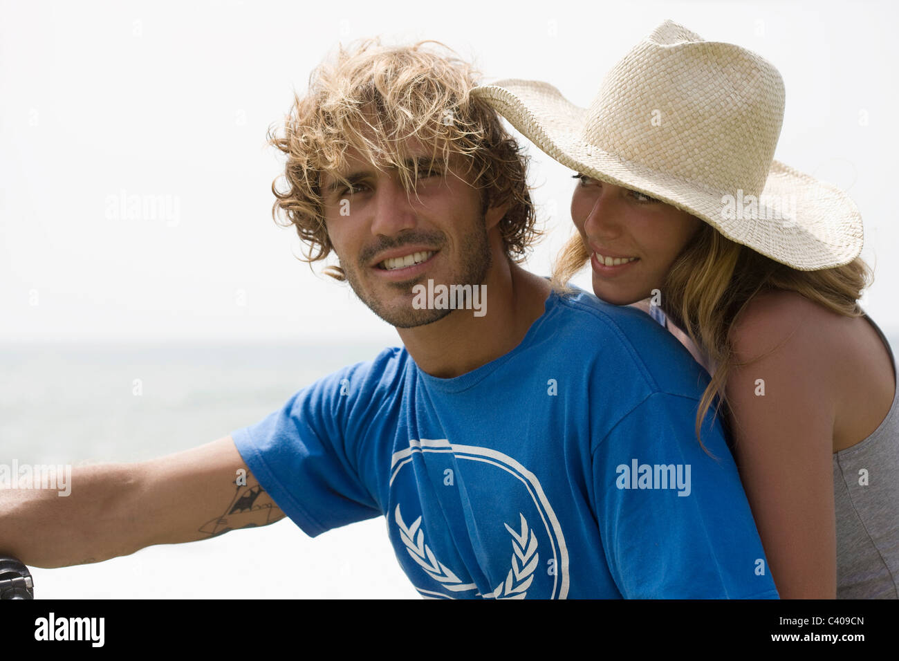 Guy and girl close together, smiling Stock Photo