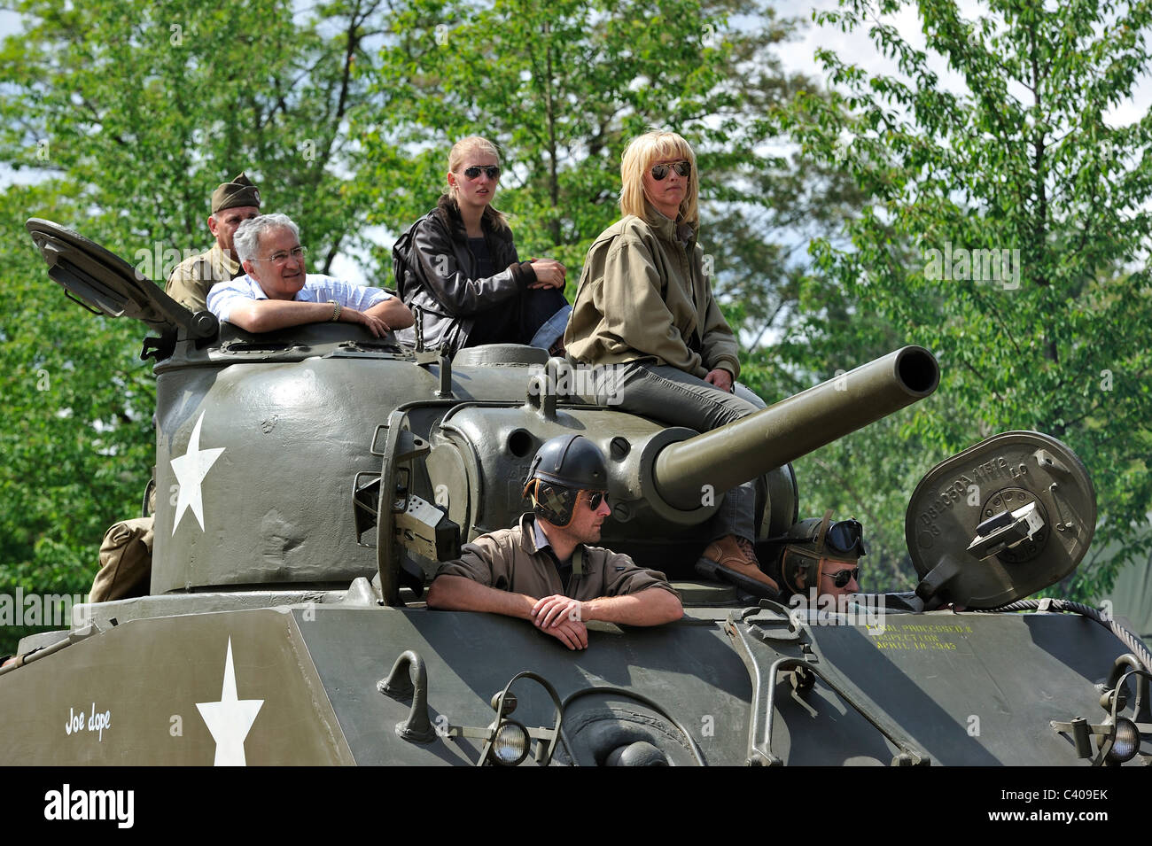 Second World War collectors on M4 Sherman battle tank during parade at the open day of the Belgian army at Leopoldsburg, Belgium Stock Photo