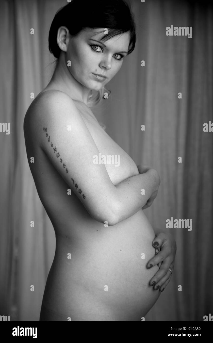 pregnant woman staring at the camera Stock Photo picture
