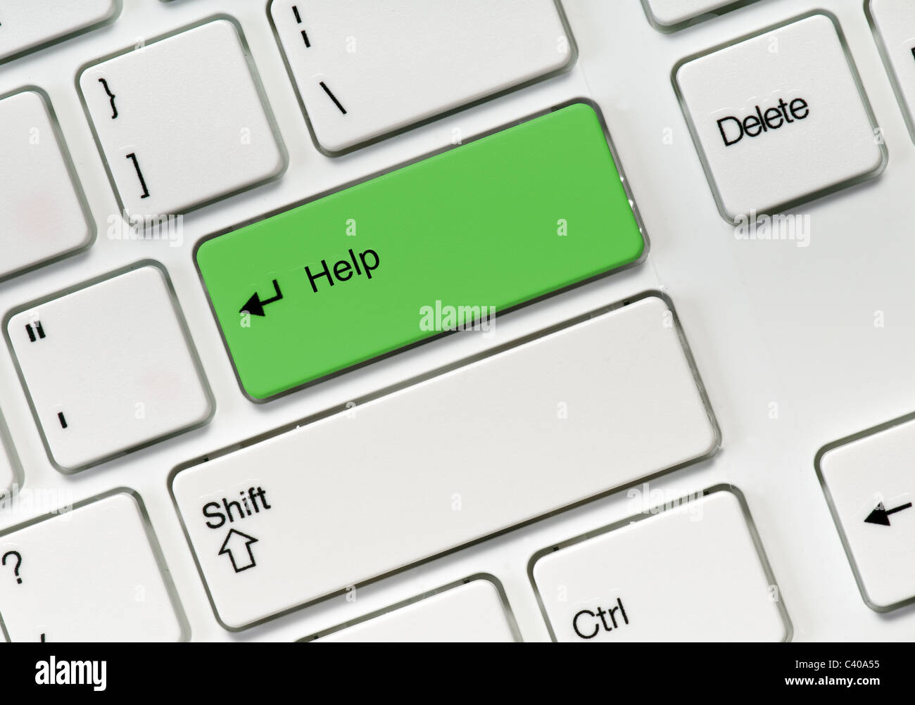 Green Help button on white keyboard Stock Photo