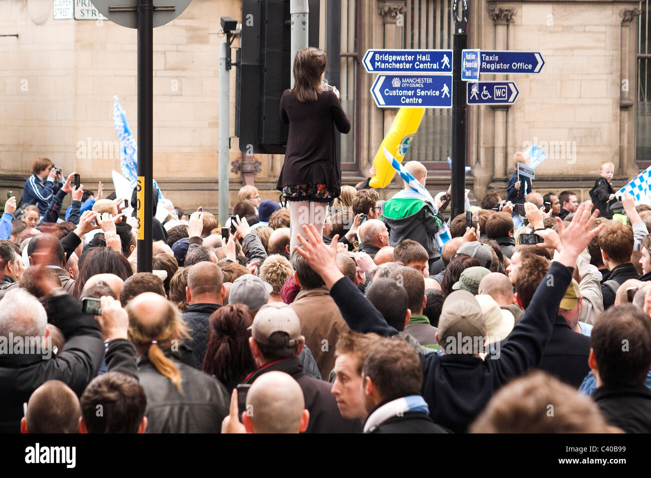 Fans gather along Princess Street for the Manchester City Cup Parade, 2011 Stock Photo