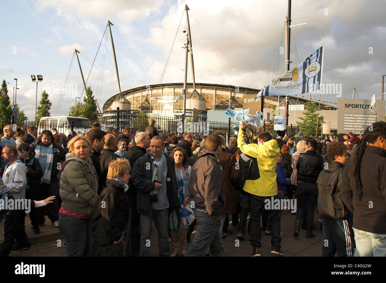 Fans gather outside the City of Manchester Stadium, now the Etihad,  for the Manchester City Cup Parade, 2011 Stock Photo