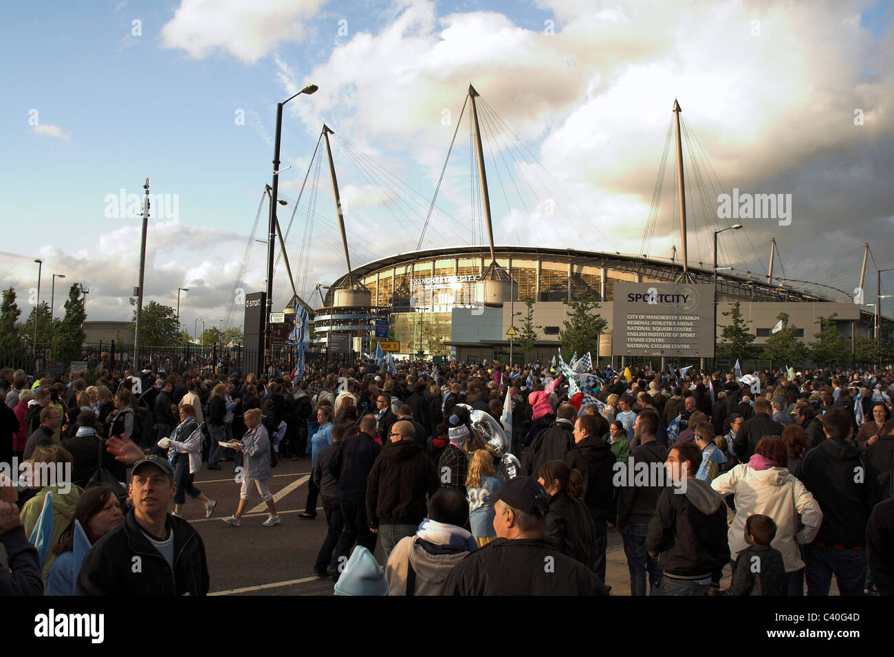 Fans gather outside the City of Manchester Stadium, now the Etihad,  for the Manchester City Cup Parade, 2011 Stock Photo