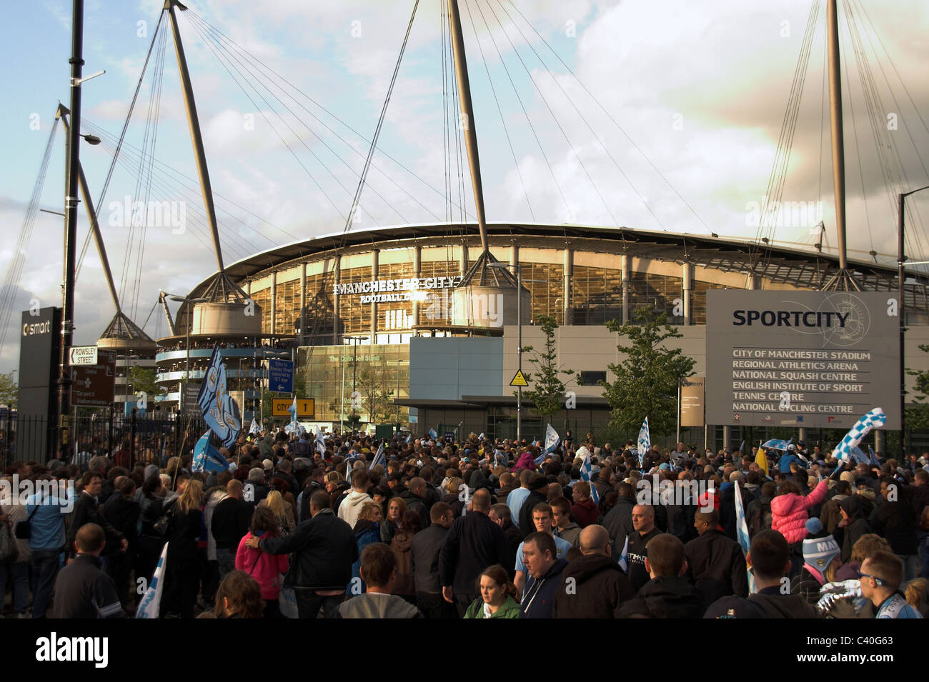 Fans gather outside the City of Manchester Stadium, now the Etihad,  for the Manchester City Cup Parade, 2011 Stock Photo