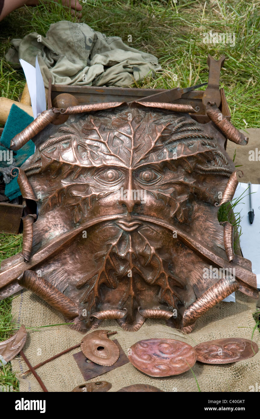 copper green man hand beaten craft pagan Stock Photo Alamy