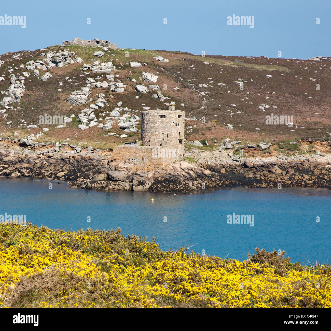 Cromwell's Castle on Tresco and King Charles's Castle high on the hill from Shipman Head Down on Bryher in the Isles of Scilly Stock Photo