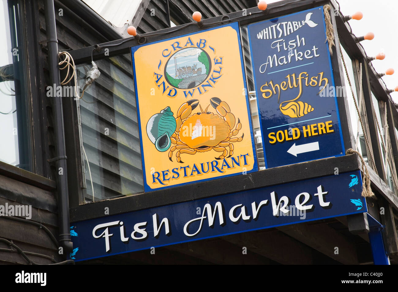 The Fish Market and Restaurant sign on the quayside of Whitstable ...