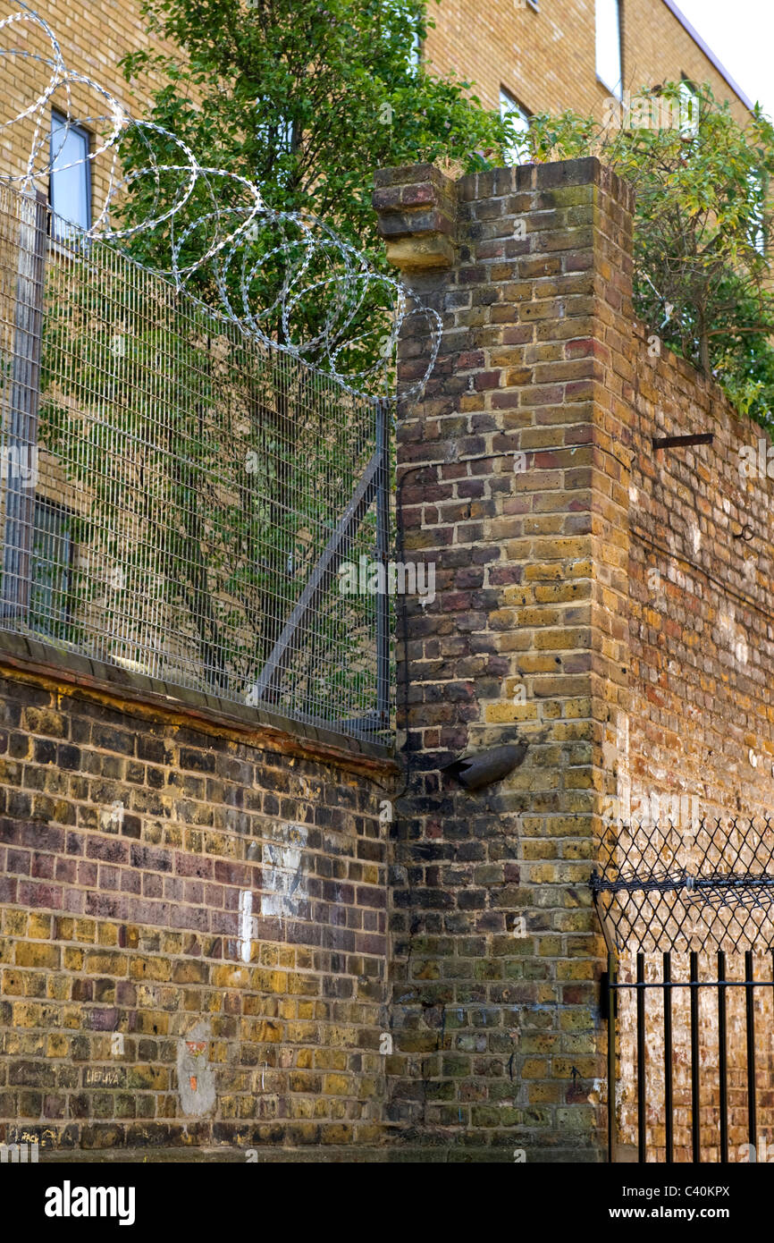 London , Kings Cross , security fencing toped with barbed wire & spike iron railing topped with