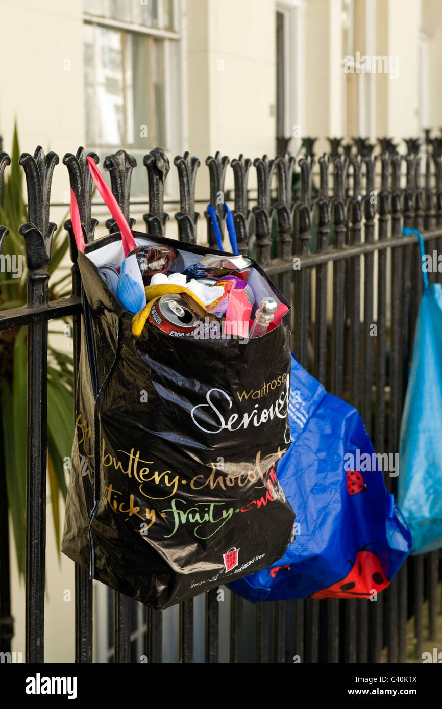 London , Kings Cross , posh rubbish in Waitrose & Tesco plastic carrier