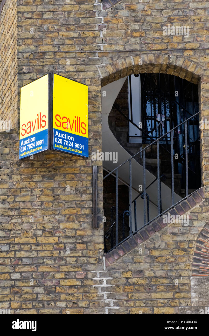 London Kings Cross distress sale ? Saviills for auction sign on modern contemporary multistorey building Stock Photo