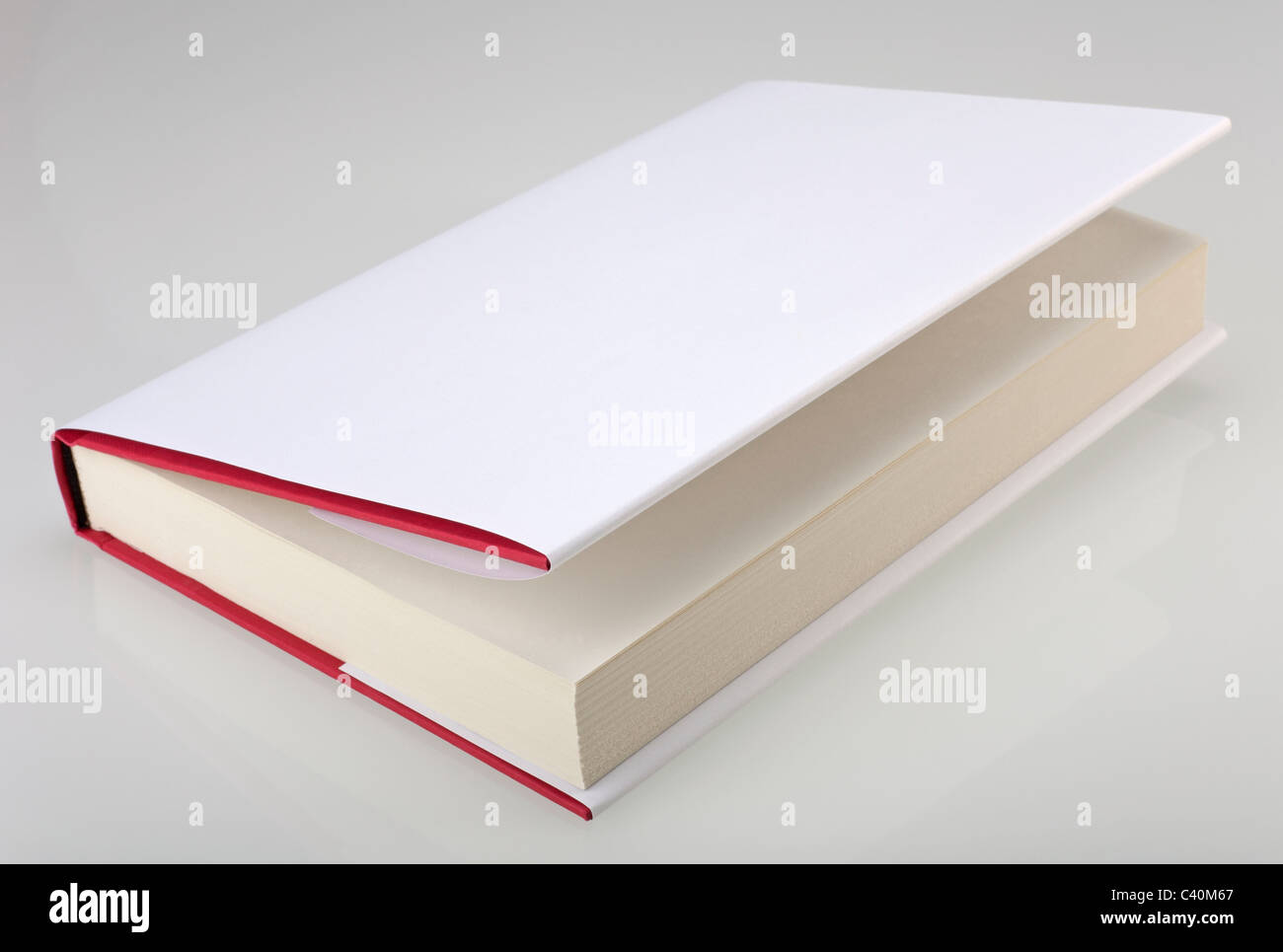 Hardcover book with white, plain cover Stock Photo