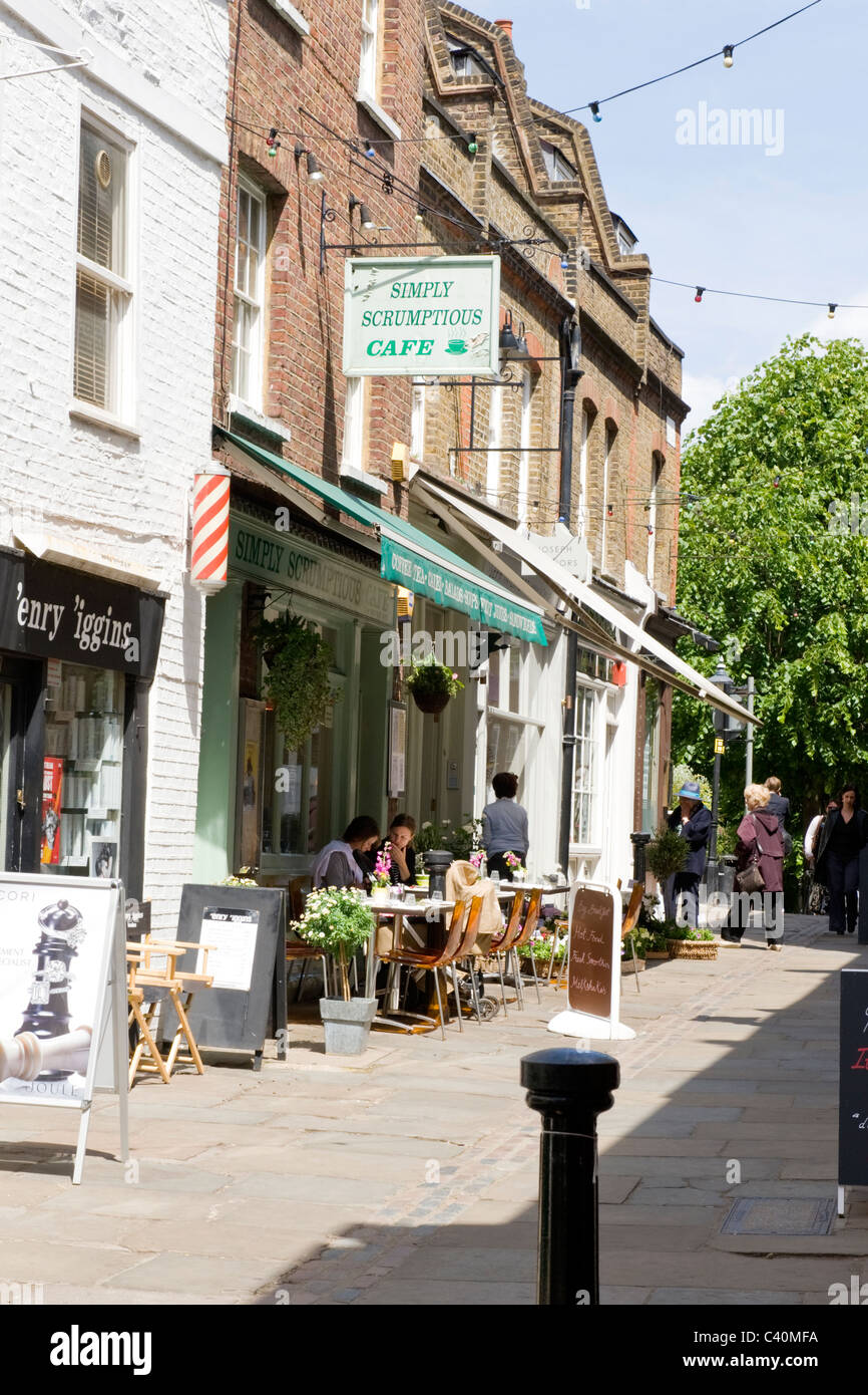 London , Hampstead Village , Flask Walk , The Simply Scrumptious cafe restaurant snack or coffee bar , pavement chairs & tables Stock Photo
