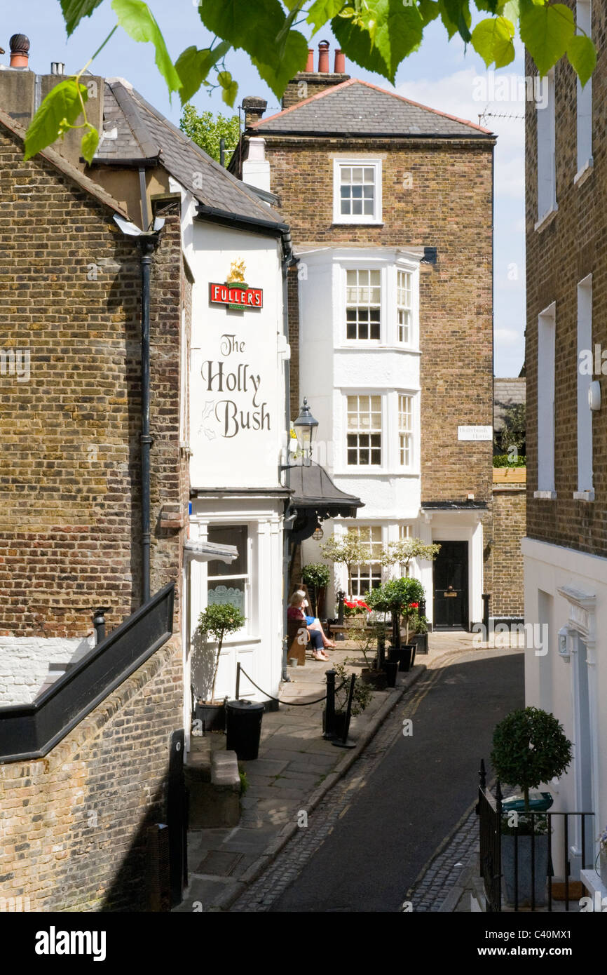 London Hampstead Village The Holly Bush Fullers mews pub bar erstwhile stables of painter George Romney converted early 1800's sunshine planters Stock Photo