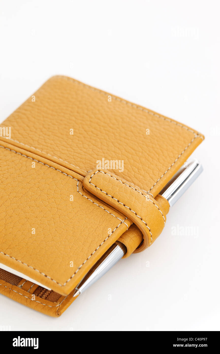 Close up of a closed leather Filofax against a white background Stock Photo
