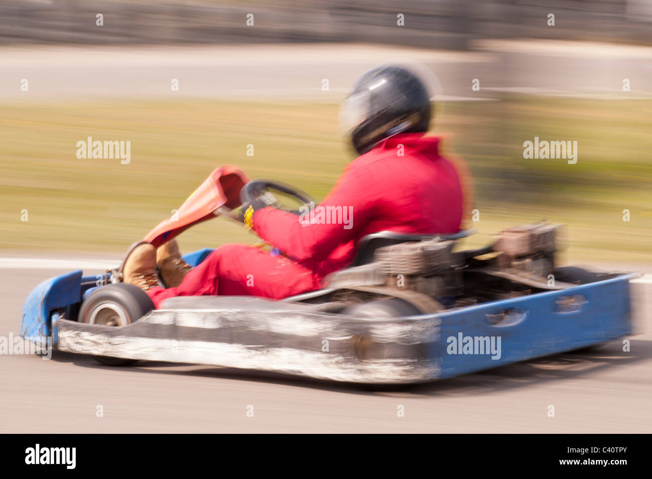 A petrol powered Go cart showing deliberate motion blur on a race track in the Uk Stock Photo