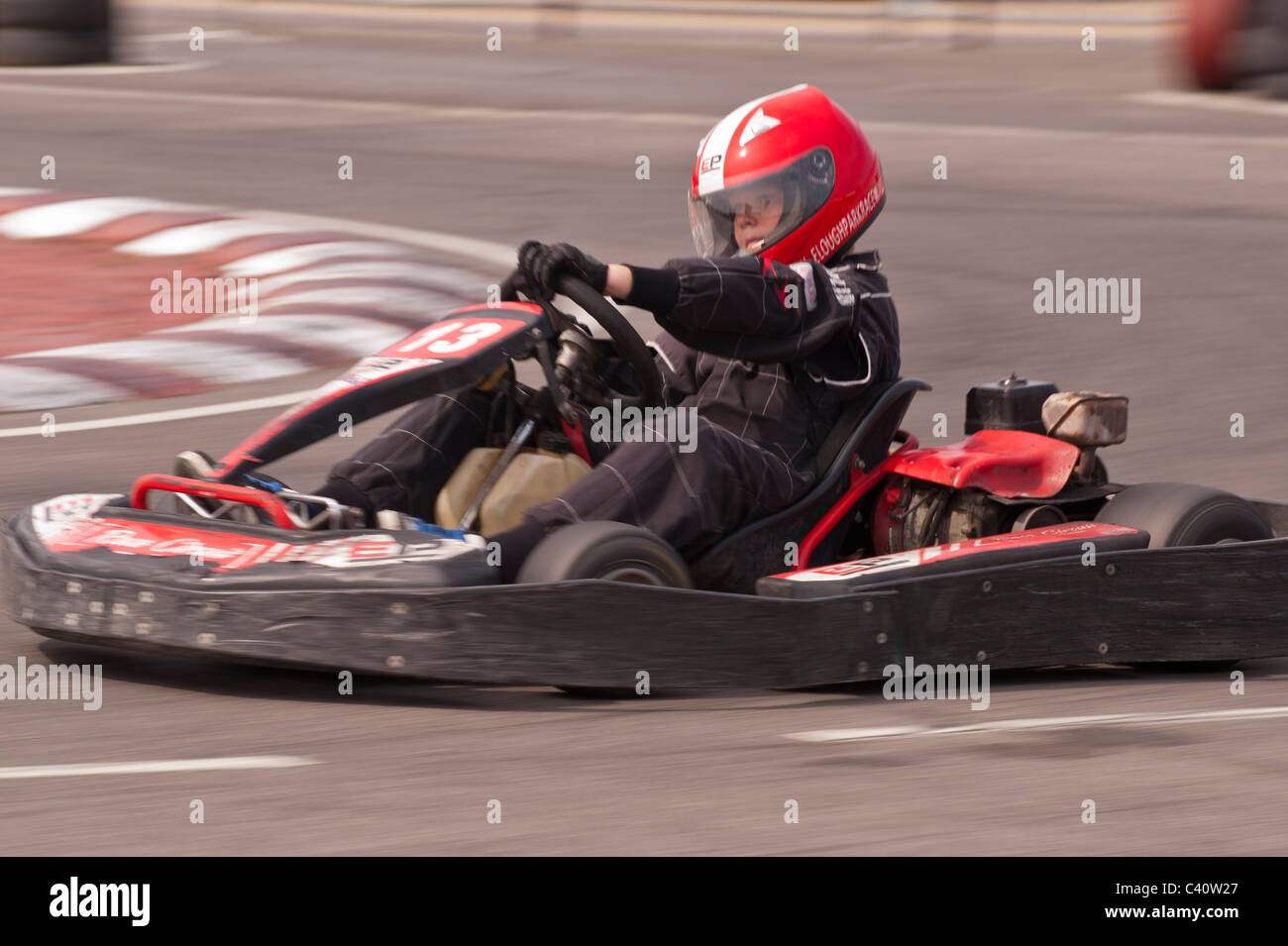 A petrol powered Go cart showing deliberate motion blur on a race track in the Uk Stock Photo