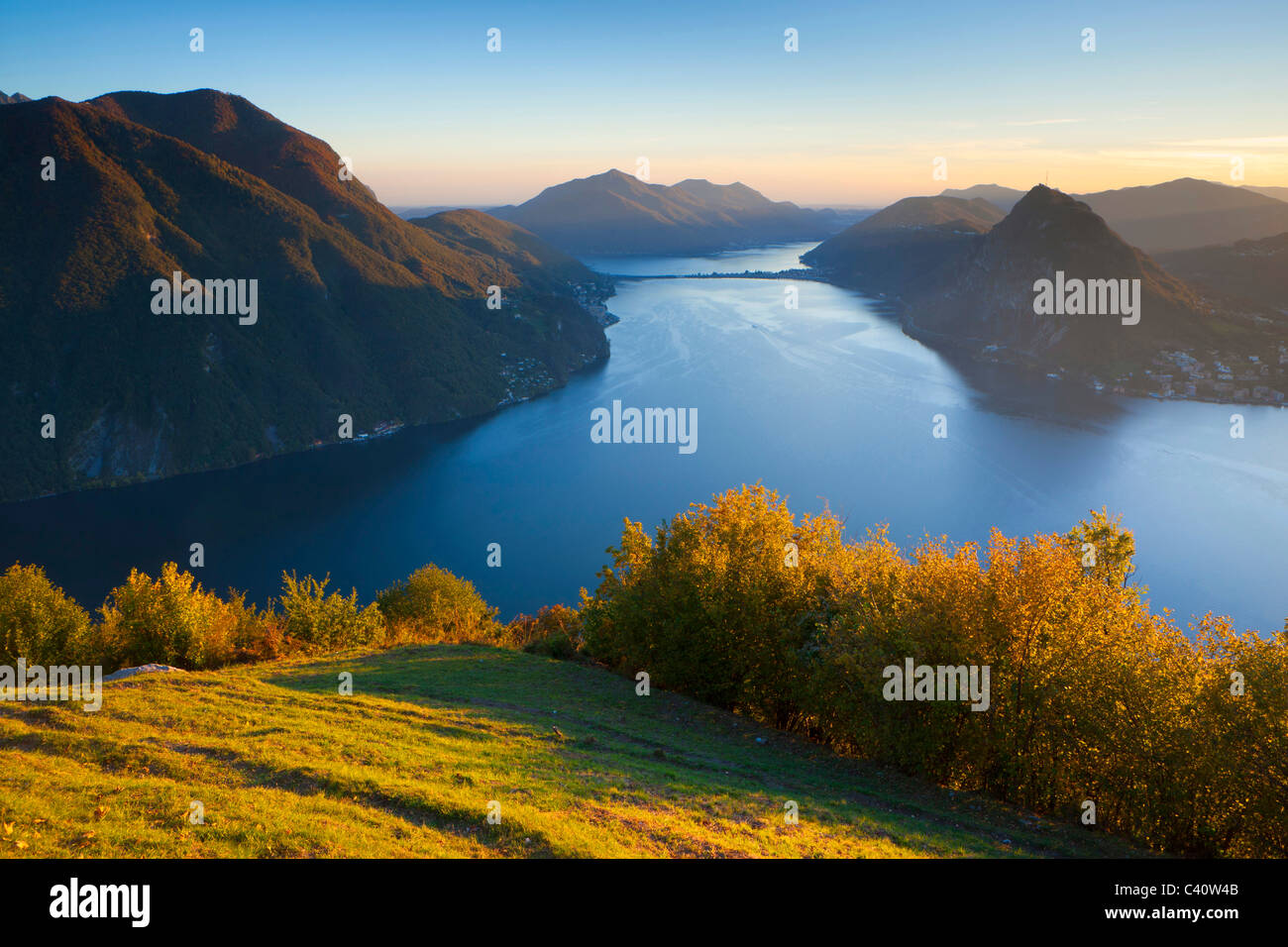from Monte Brè, Switzerland, Europe, canton Ticino, lake, Lago di Lugano, lake dam, vantage point, view point, meadow, trees, ev Stock Photo