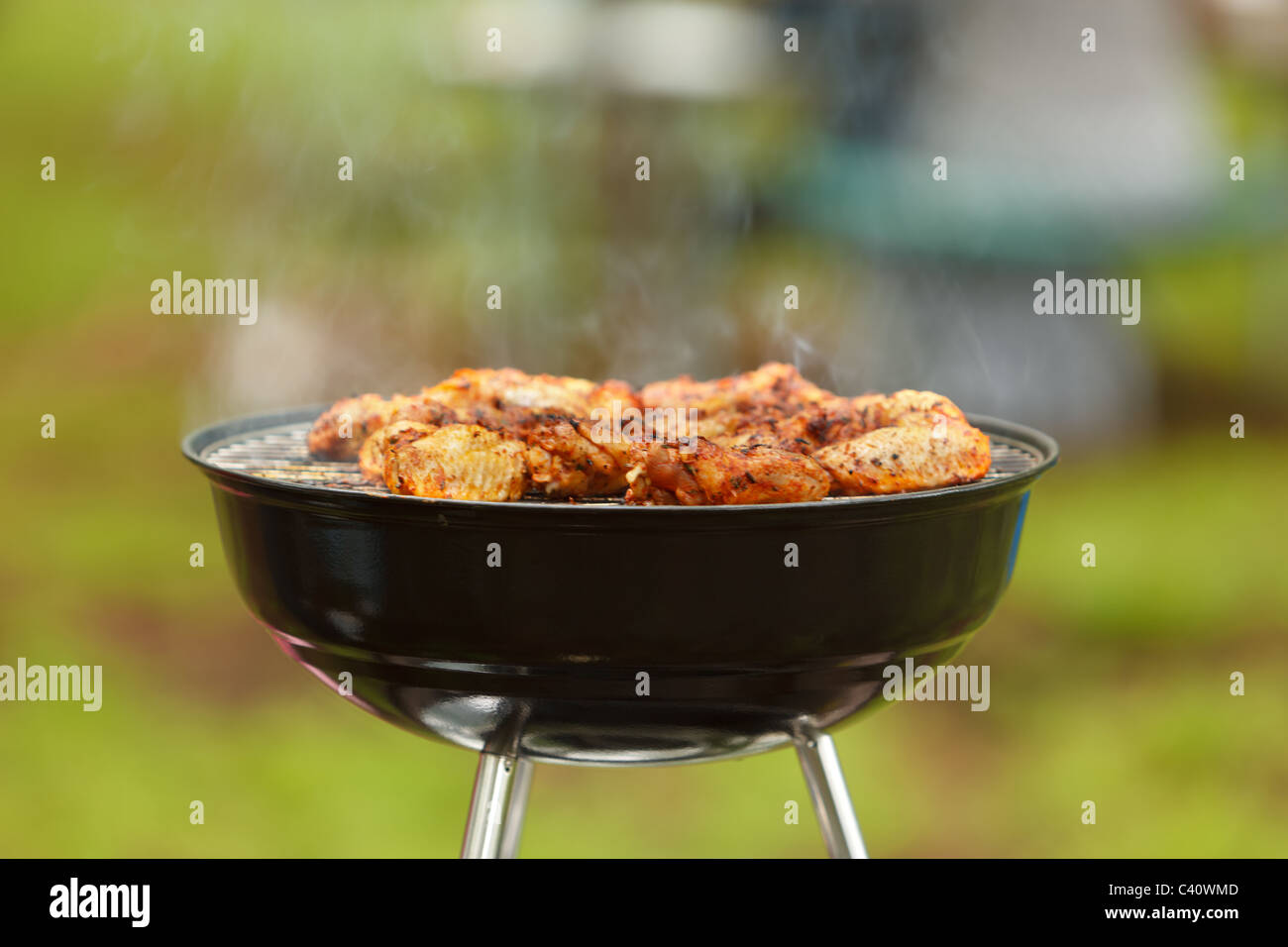 Eating out meat on barbecue. Stock Photo