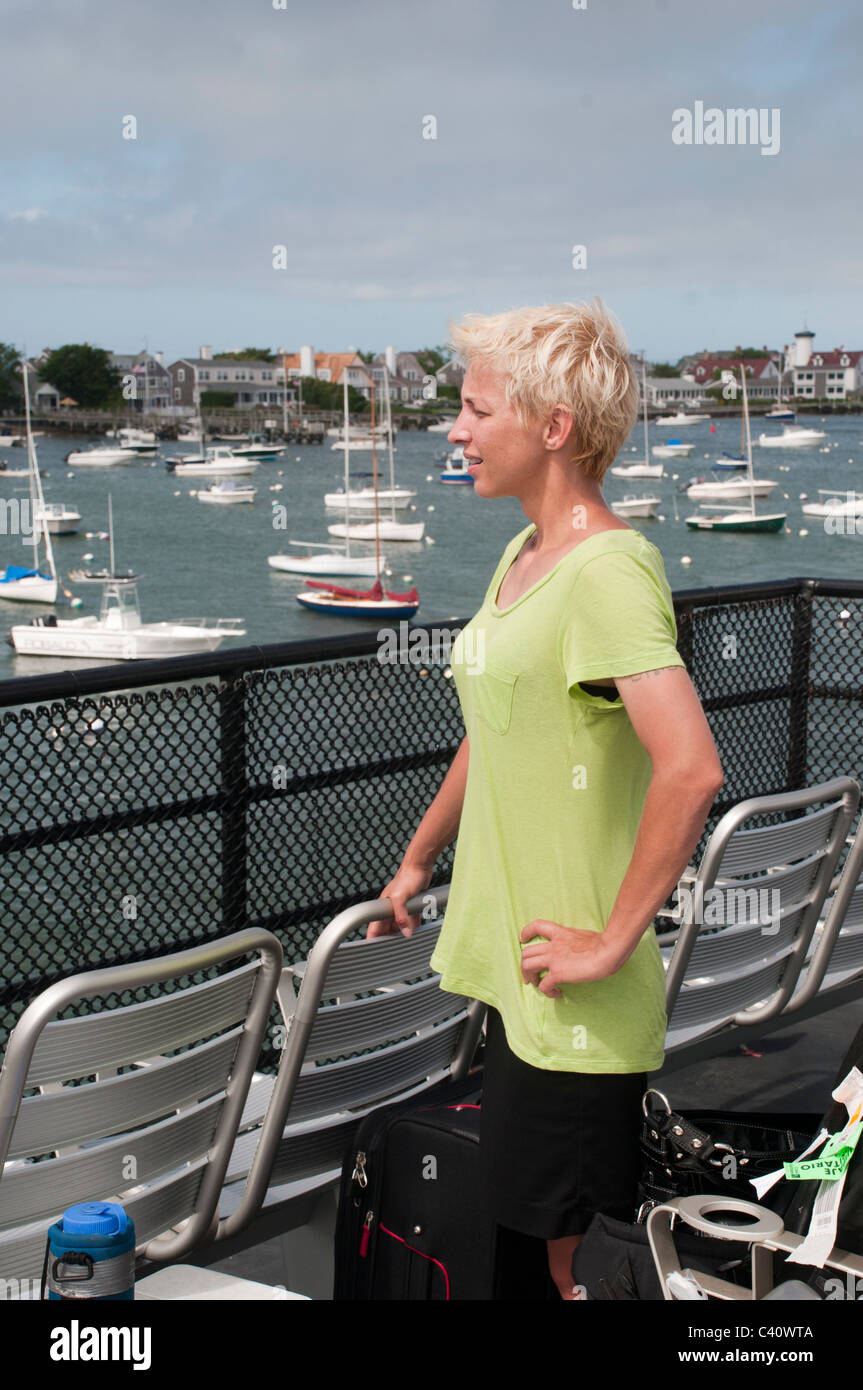 A passenger looks to the Nantucket Harbor. Stock Photo