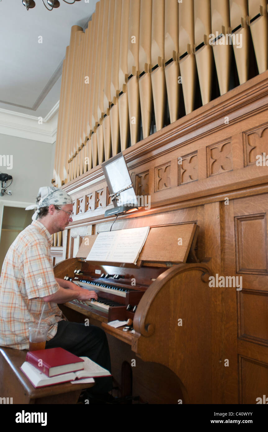 A man play the organ in the First Congressional Church in Nantucket Town. Stock Photo