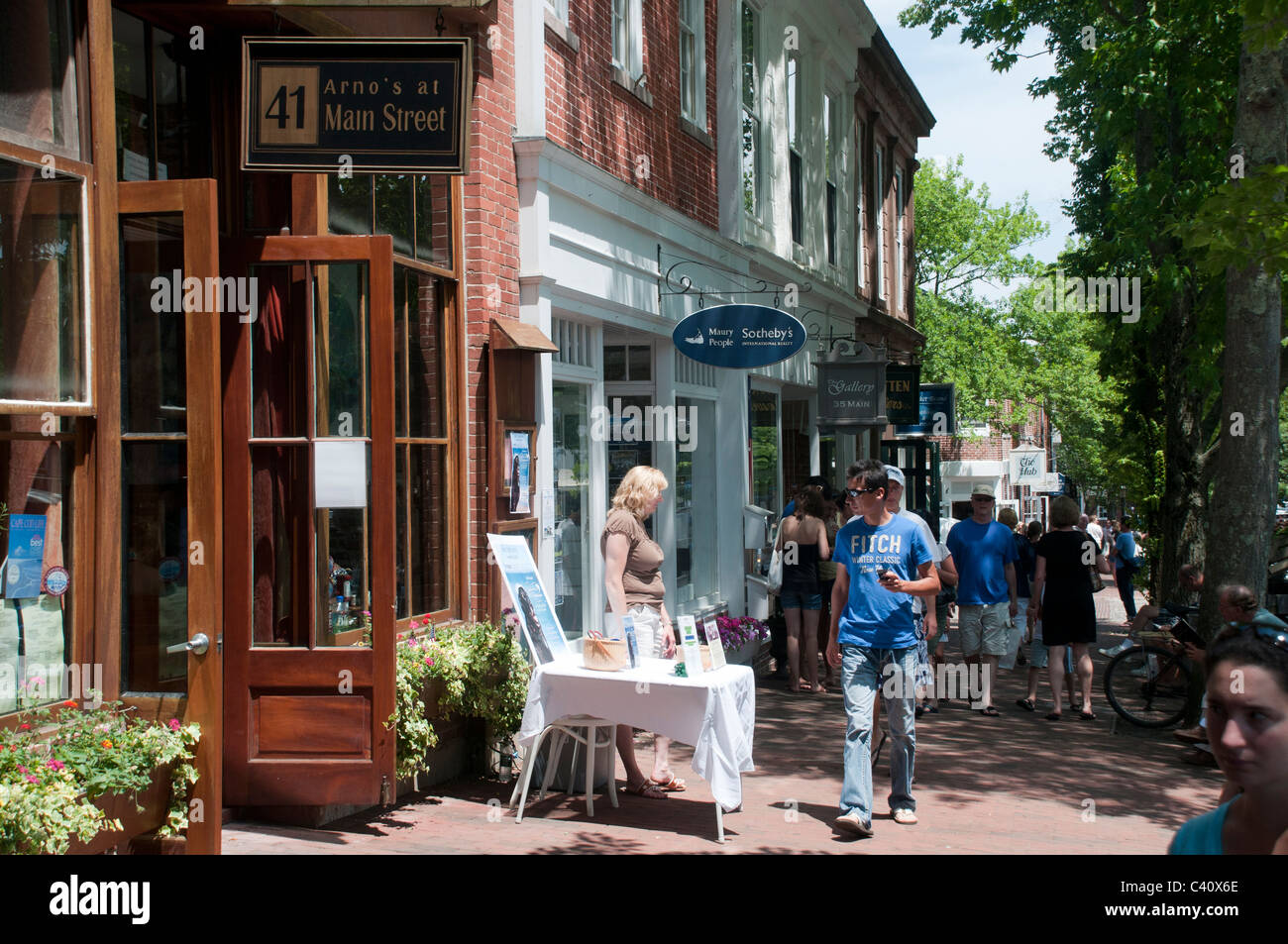 People walk past shops in Nantucket Town. Stock Photo