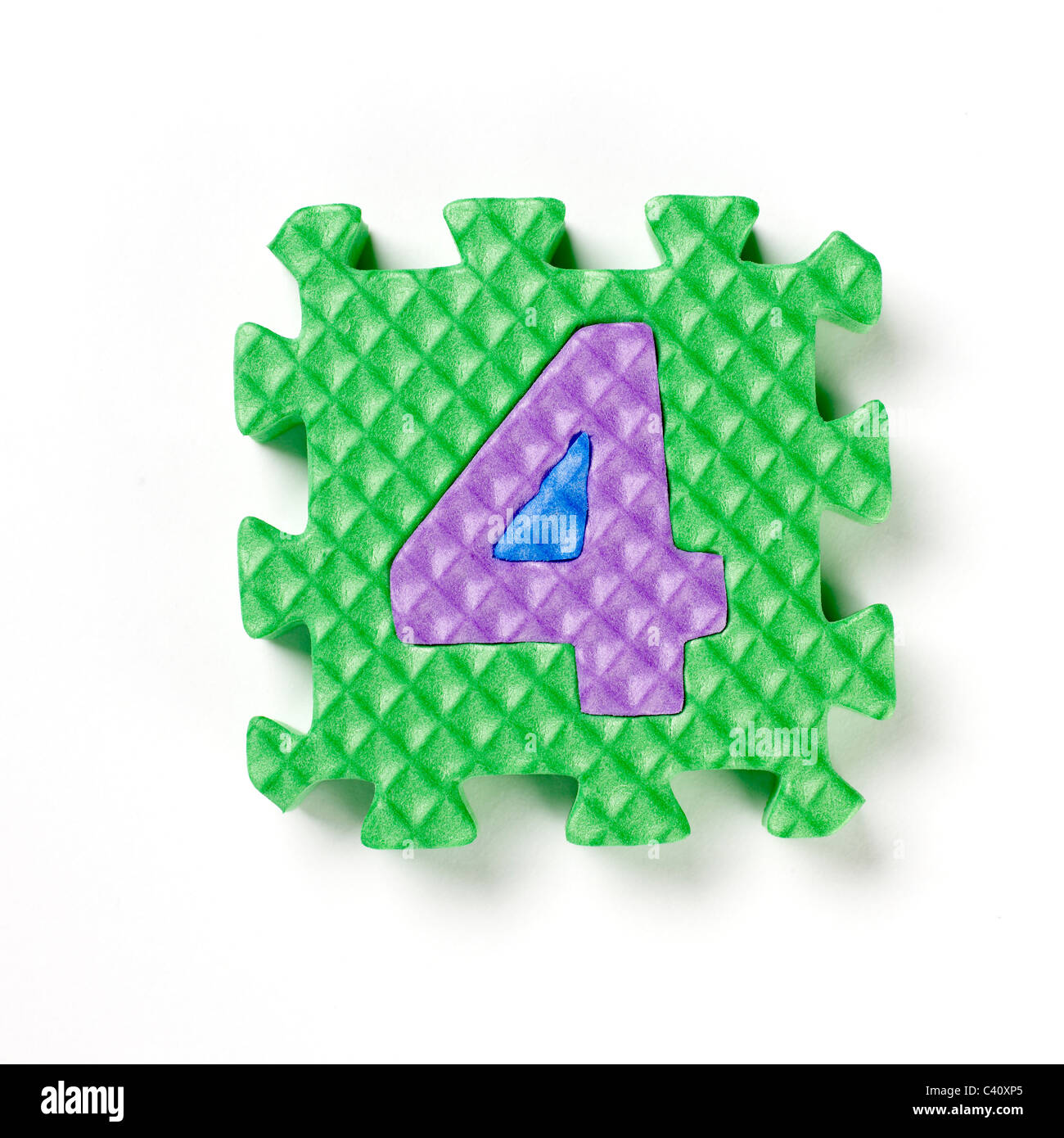 Puzzle piece number four 4 Stock Photo