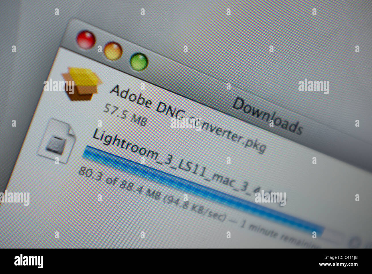 close up of a computer screen showing items downloading Stock Photo Alamy