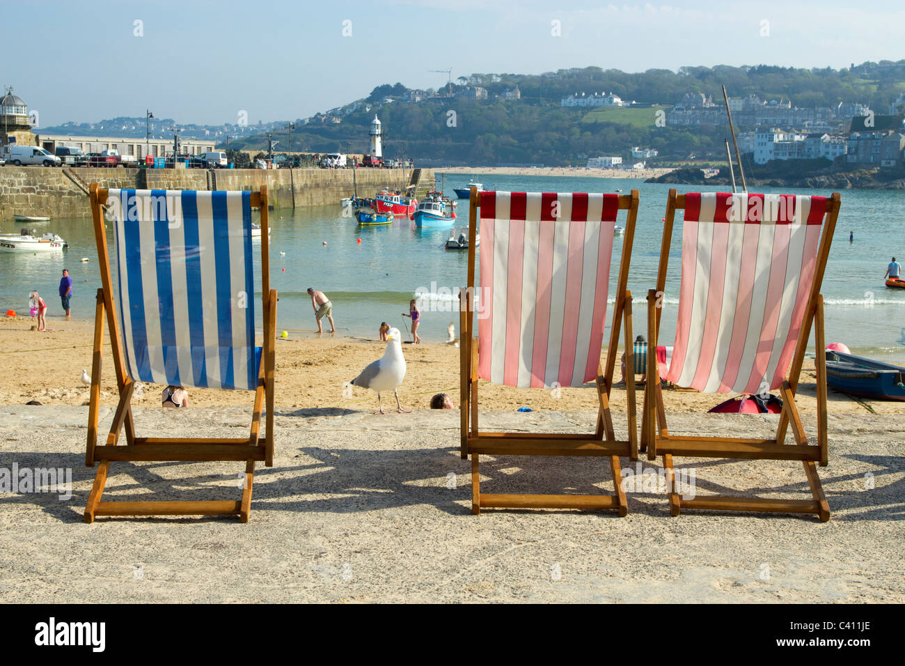 St. Ives harbour beach deckchairs, Cornwall UK. Stock Photo