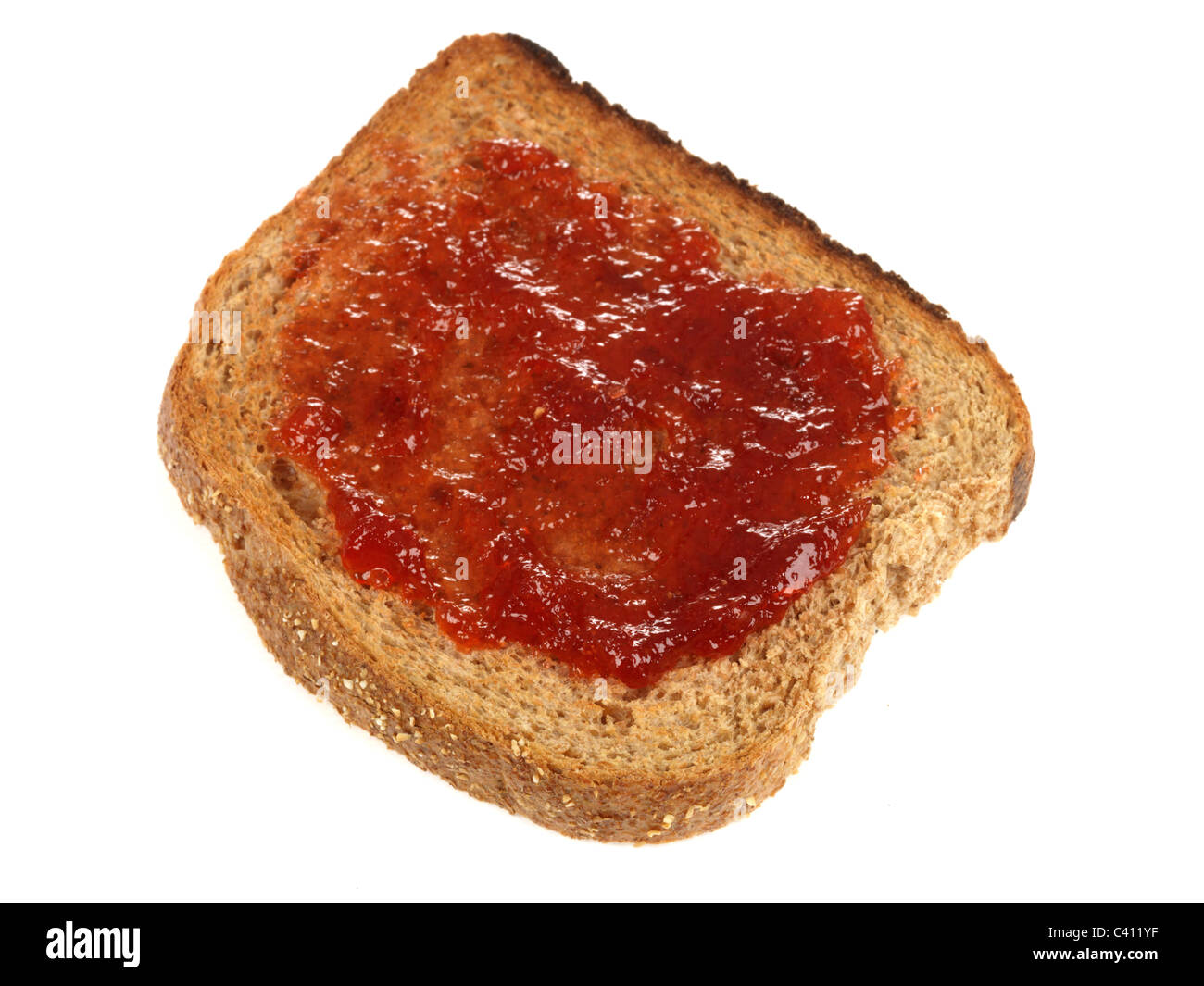 Strawberry Jam Spread On A Slice Of Wholegrain Toasted Bread As A Snack