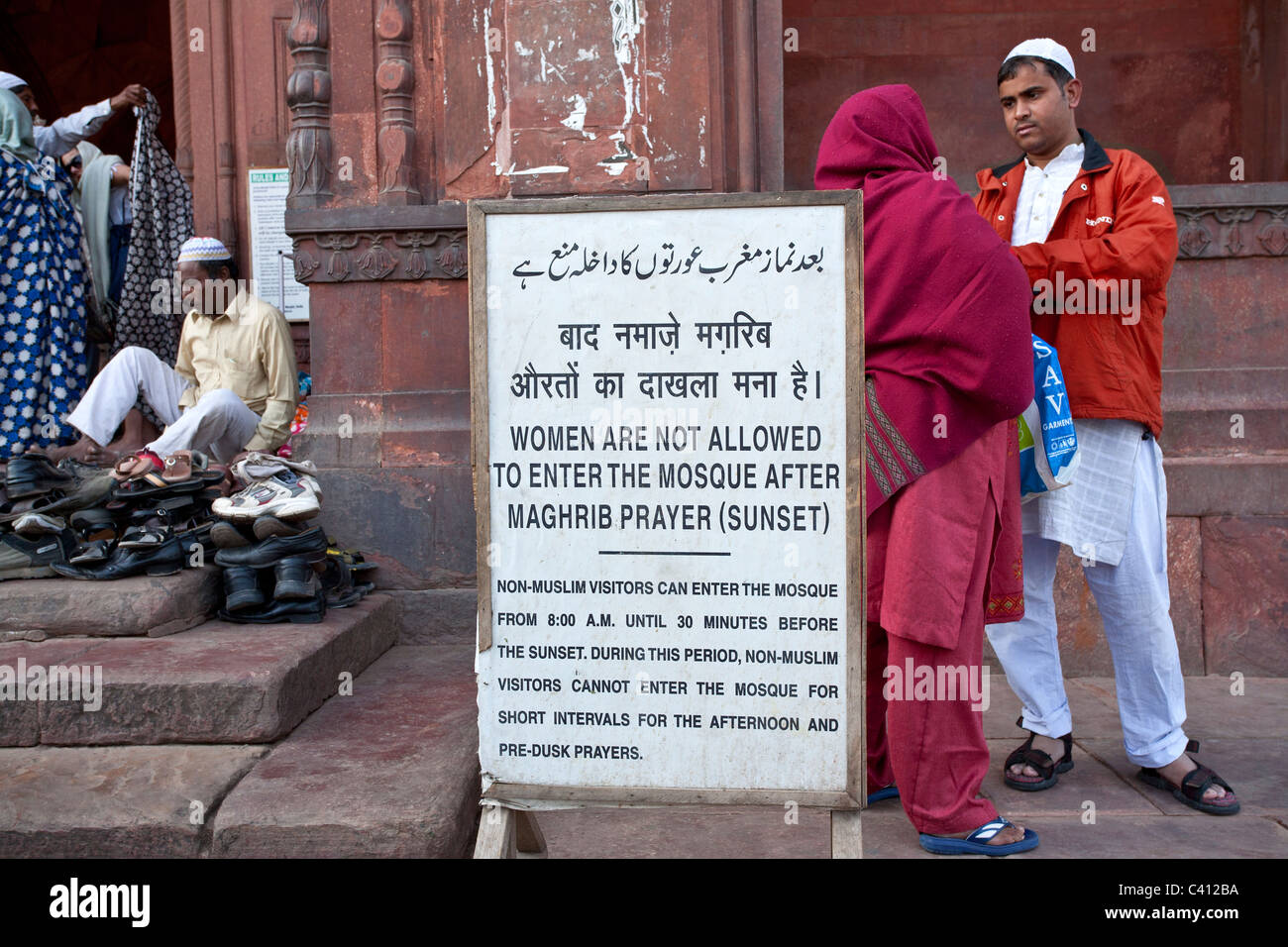 Notice board forbidding women to enter the mosque after sunset. Jama Masjid mosque. New Delhi. India Stock Photo