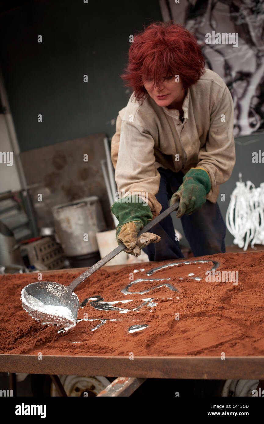 Artist DAWNY TOOTES Casting sculptures using molten aluminium made from
