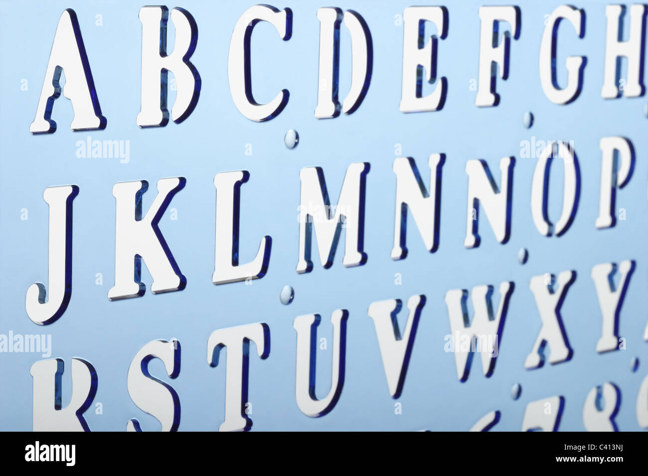 Close up of backlit plastic alphabet stencil Stock Photo
