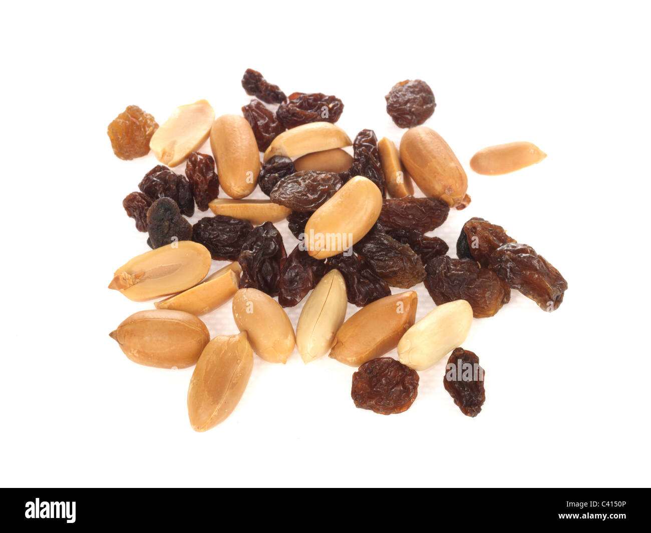 Handful Of Healthy Dried Fruit and Nuts Against A White Background With No People With copy Space Or A Clipping Path Stock Photo