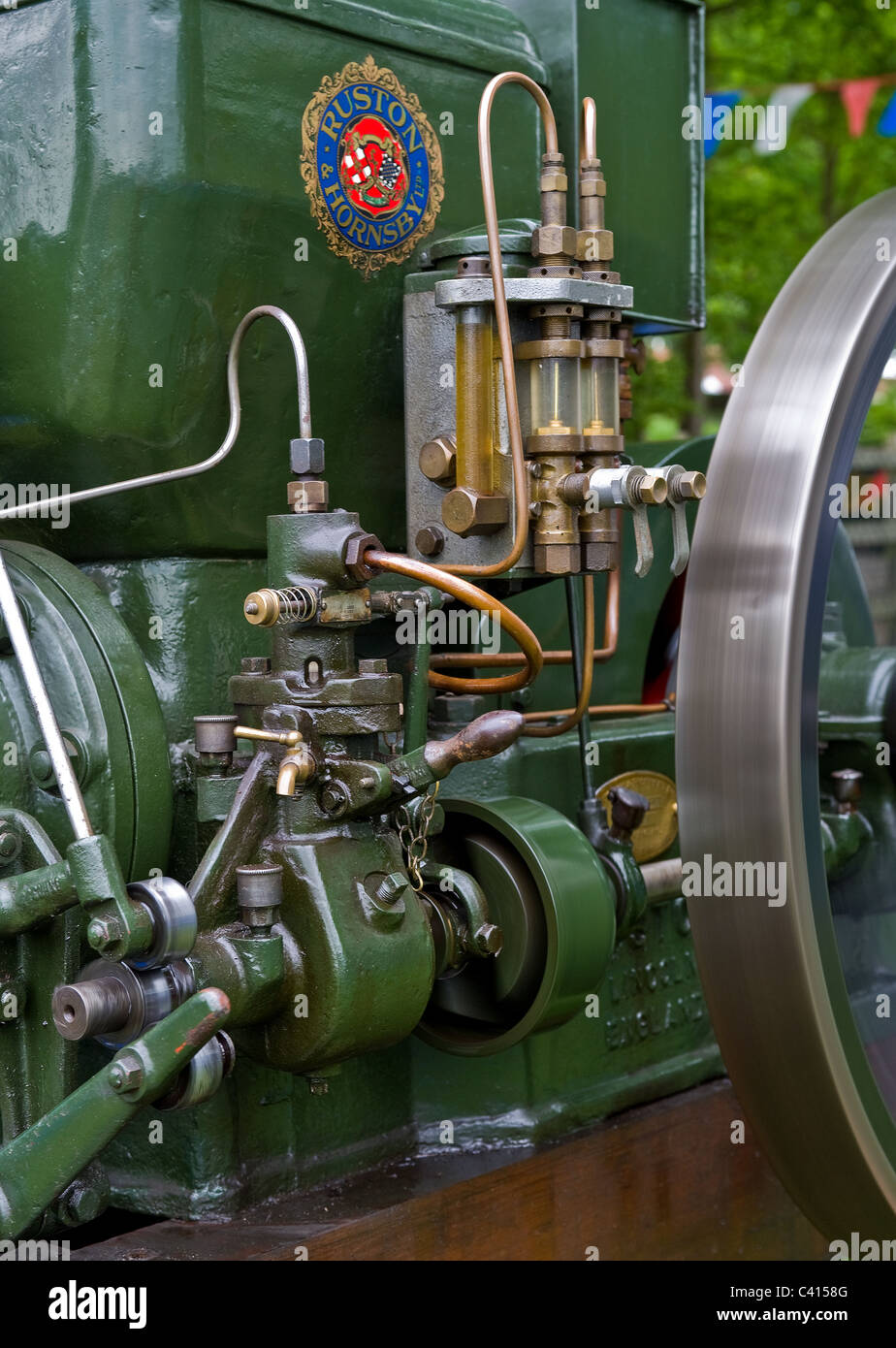 Closeup view of part of a static steam driven engine on display at a steam fair. Stock Photo