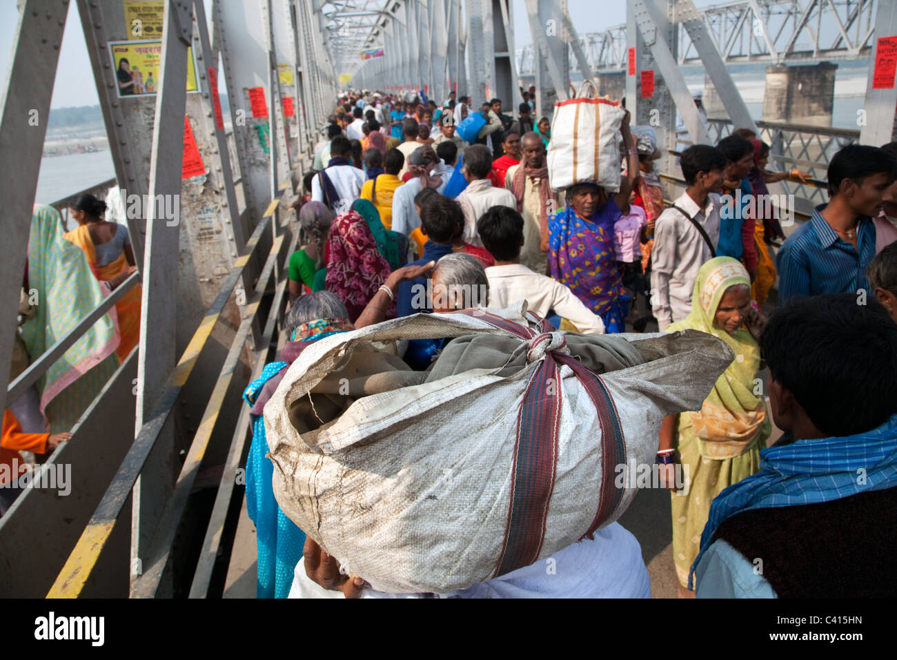 Pilgrims cross the bridge to get to Sonepur Mela in Sonepur near Patna and Hajipur in Bihar state, India. Stock Photo